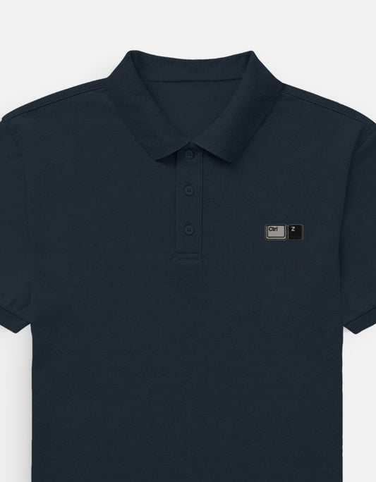 Front view of a premium heavyweight boxy pitch navy blue waffle knit polo shirt featuring minimalist  embroidery on the left chest by CTRL Z